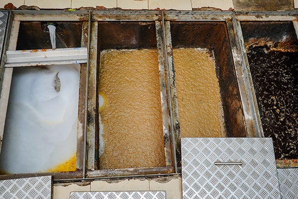 neglecting grease trap maintenance can lead to clogs, sewer backups, foul odors, and potential fines for non-compliance